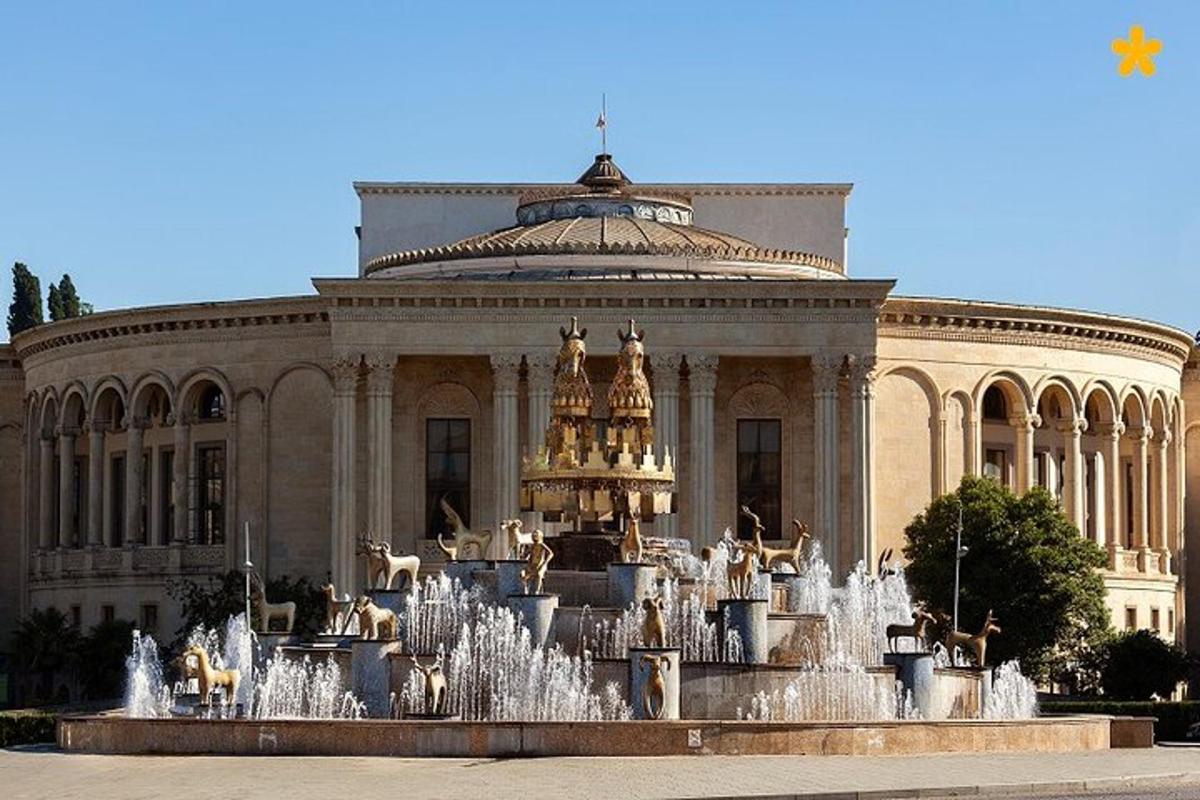 a large building with a fountain in front of it