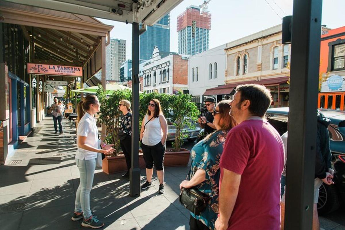 a group of people standing on a city street