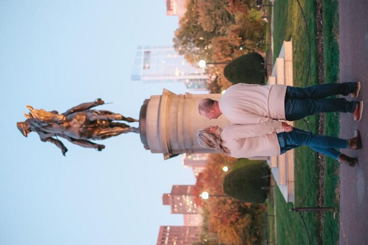 a man standing on top of a fire hydrant