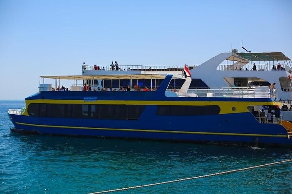 a large blue and yellow boat in the water