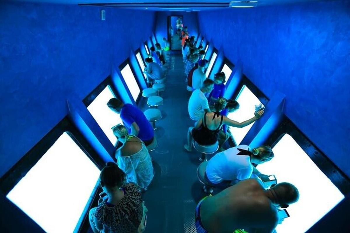 a group of people sitting in a blue room