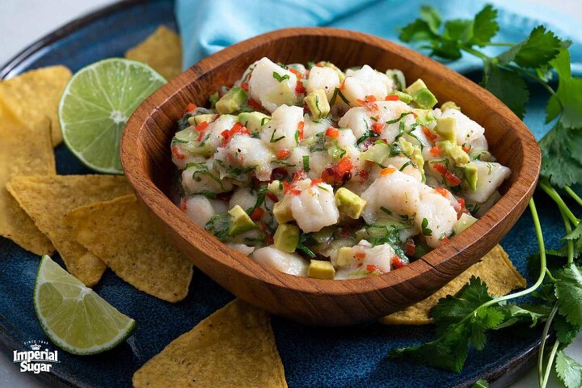 a bowl of shrimp salsa on a plate with chips