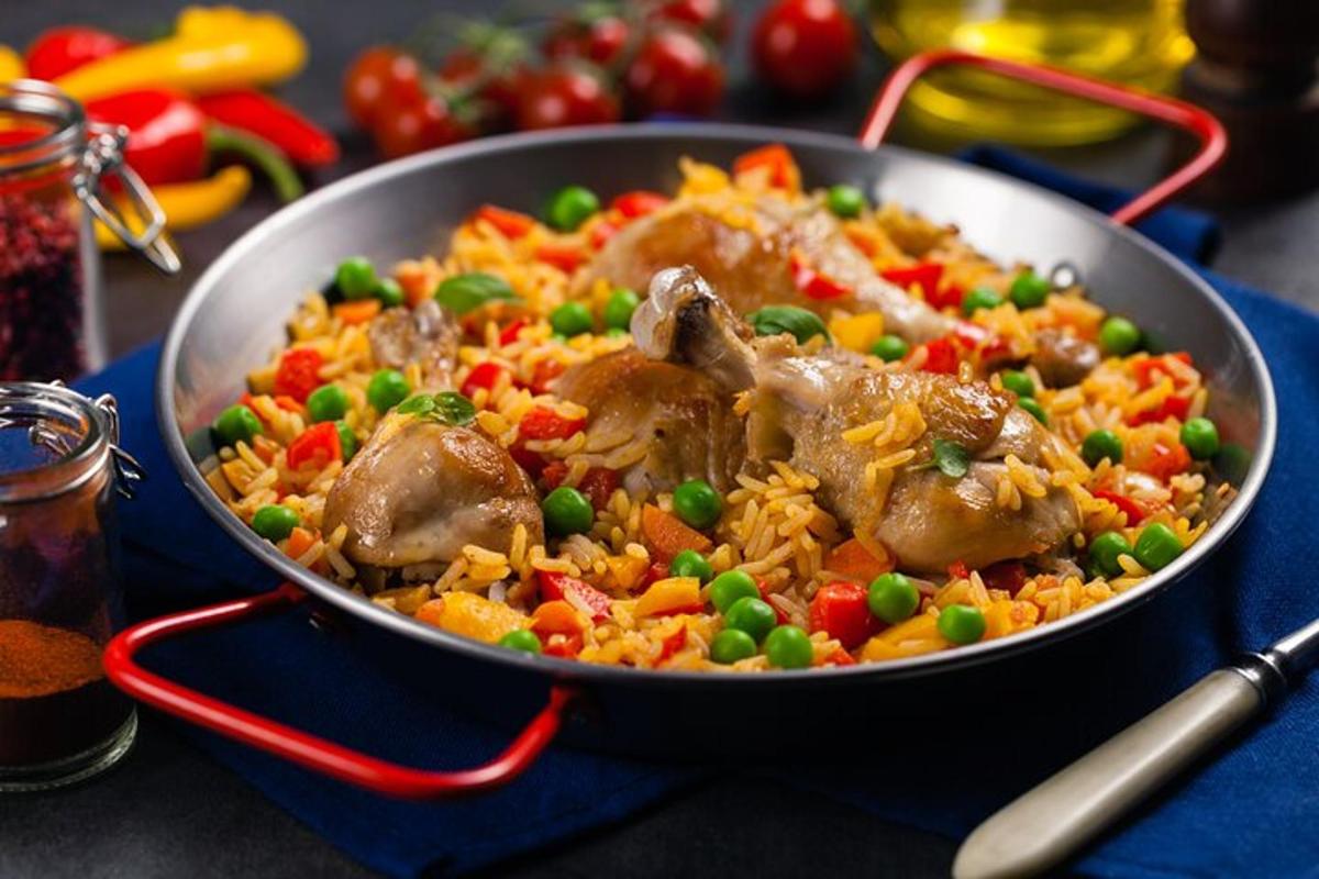 a pan of food with meat and vegetables on a table