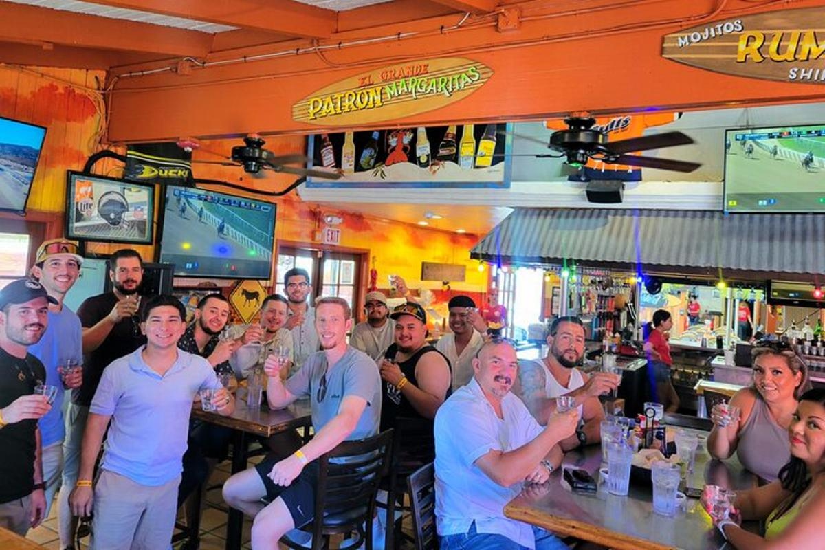 a group of people sitting in a bar