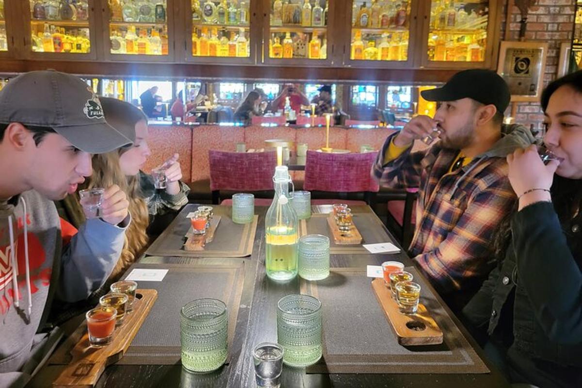 a group of people sitting at a table eating food