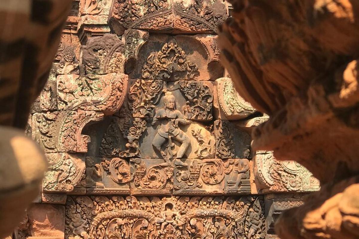 a stone wall with a carving of a man on it
