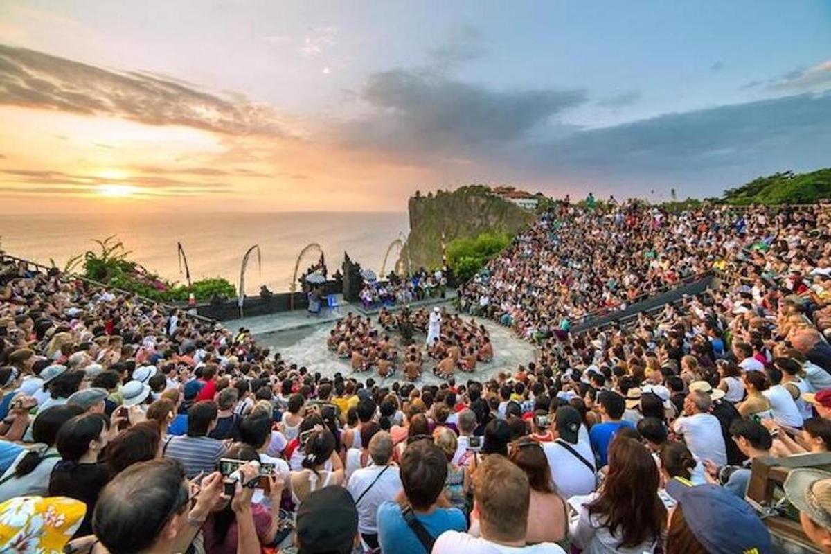 a large crowd of people watching a concert on a stage
