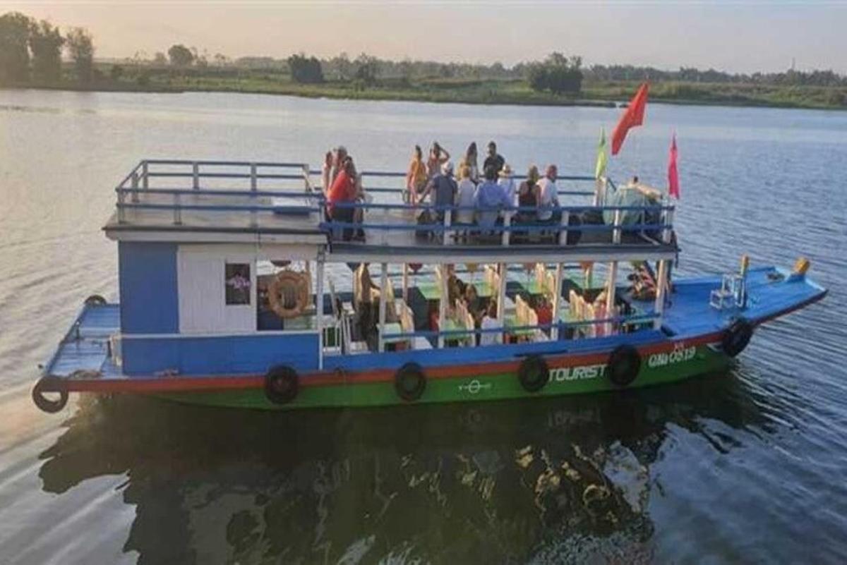 a group of people on a boat on the water