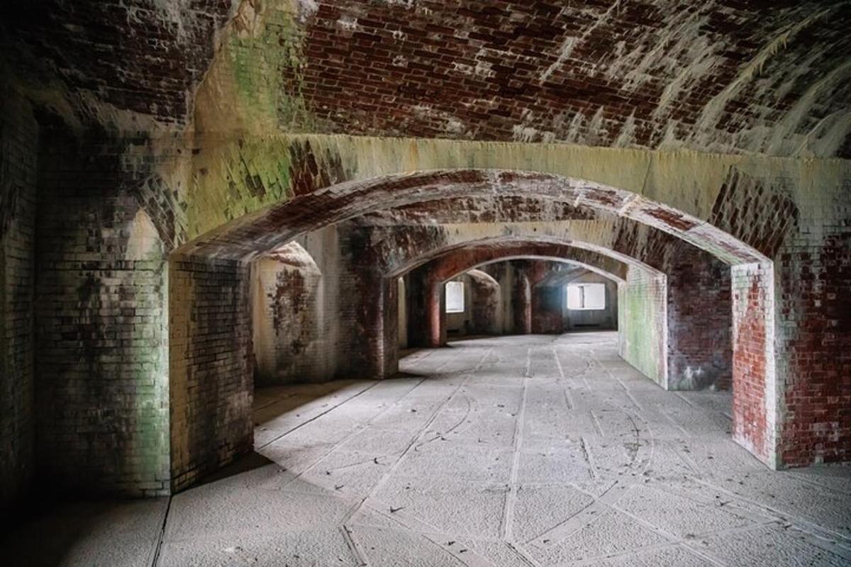 an old brick tunnel with an archway in a building