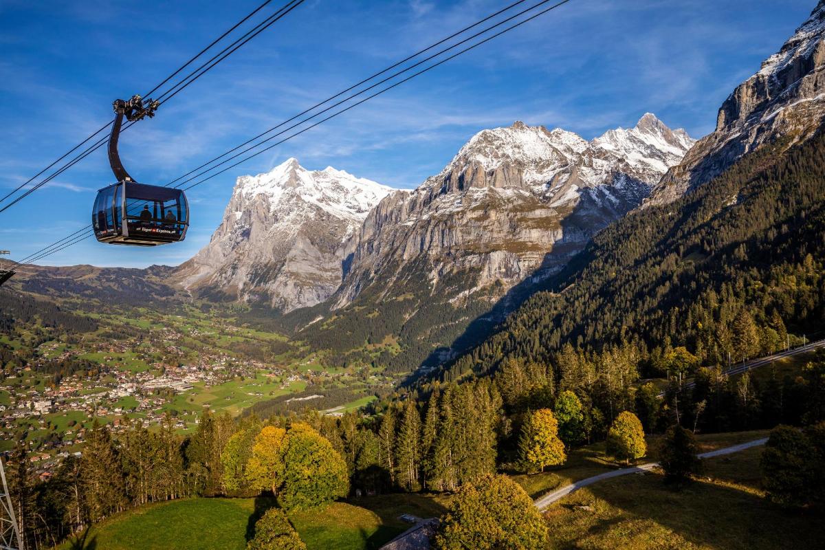 a gondola ride over a valley in the mountains