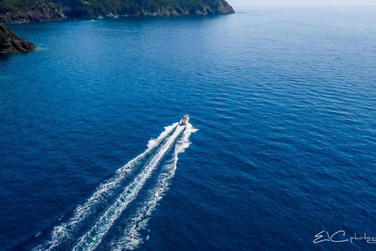 an aerial view of a boat in the water