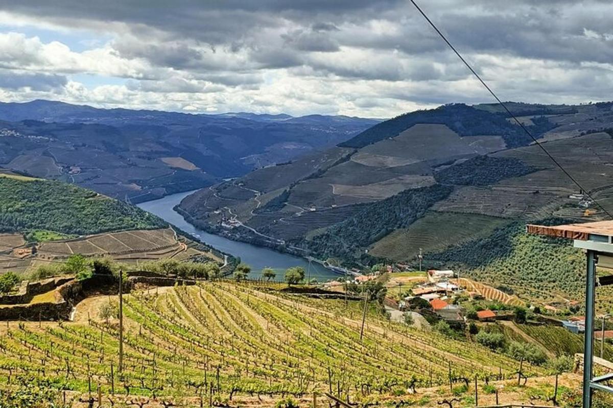 a view of a valley with a river and mountains