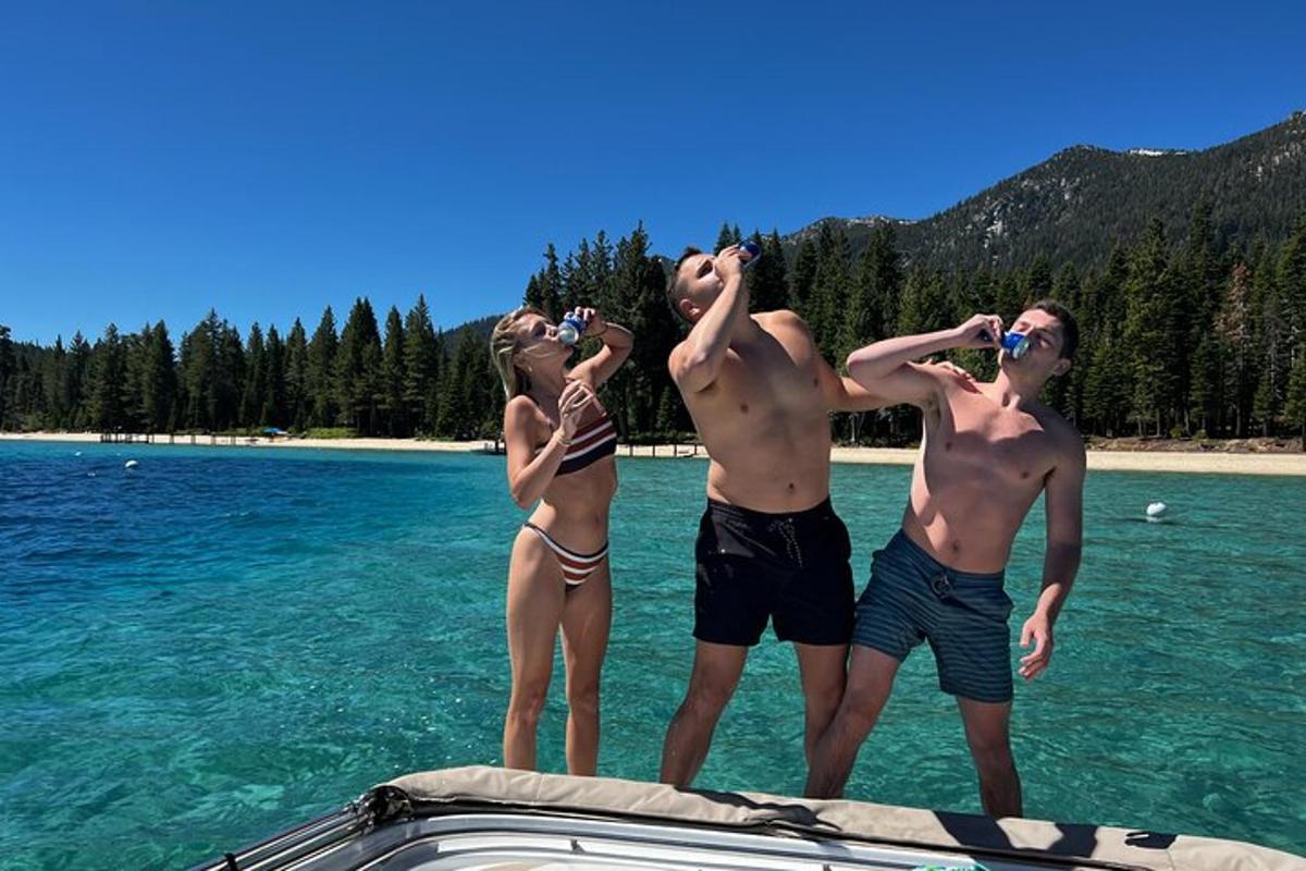 a group of people standing on a boat in the water