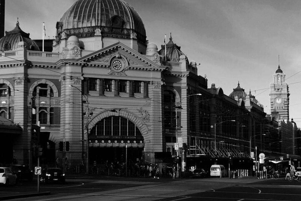 a black and white photo of a building with a clock