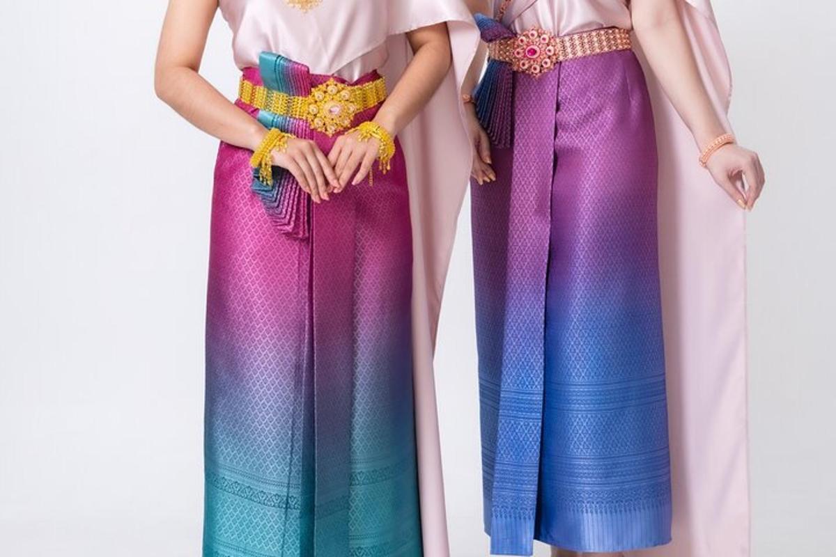 two barbie dolls dressed in colorful outfits