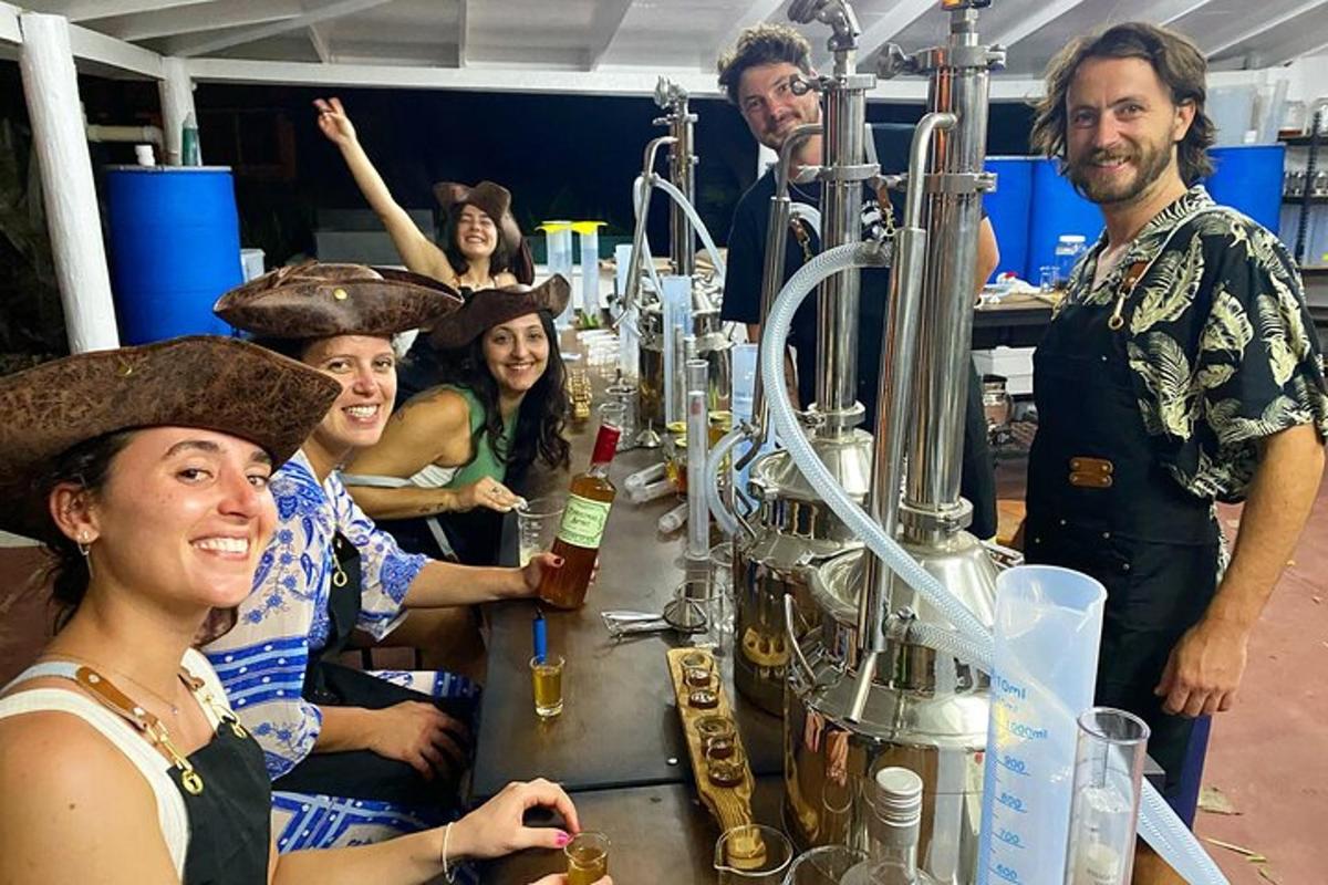 a group of people standing around a table with drinks