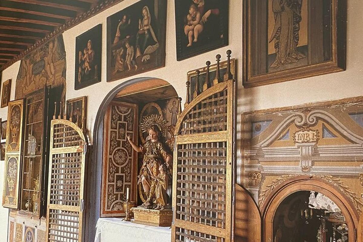 a room with a wall with a statue on it