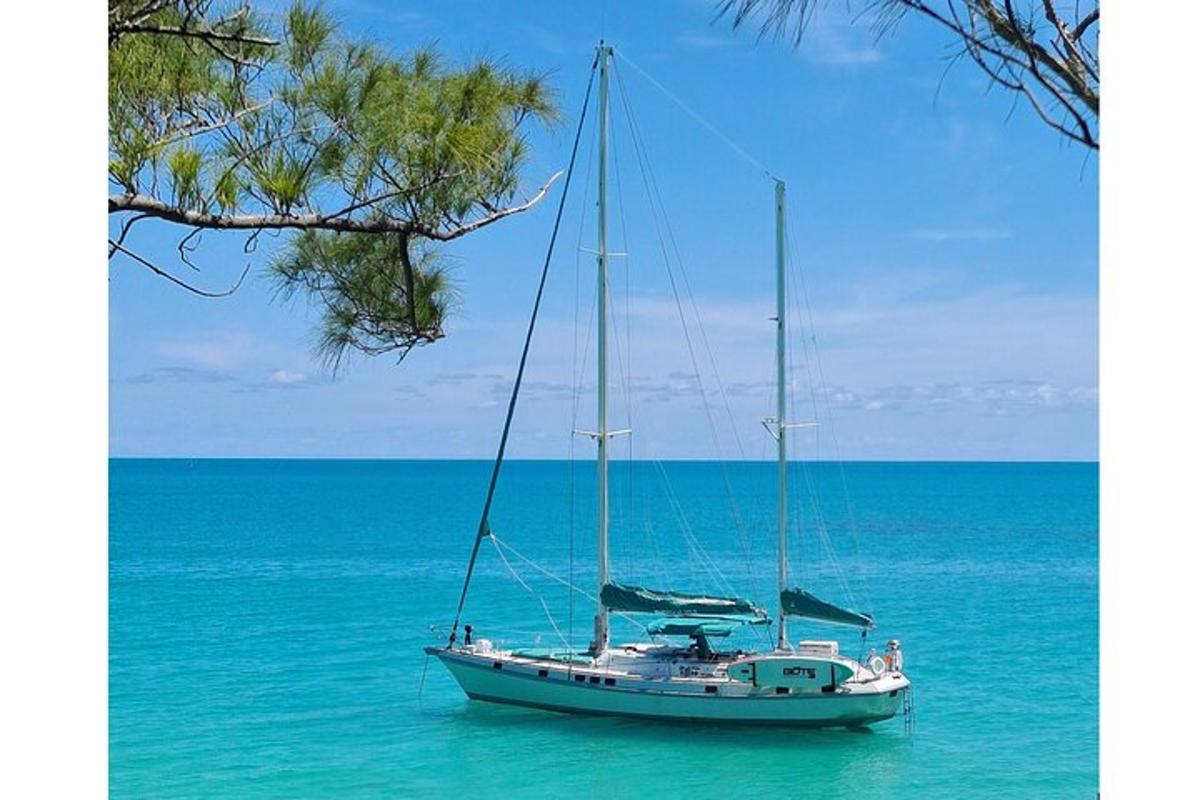 a boat sitting in the water in the ocean