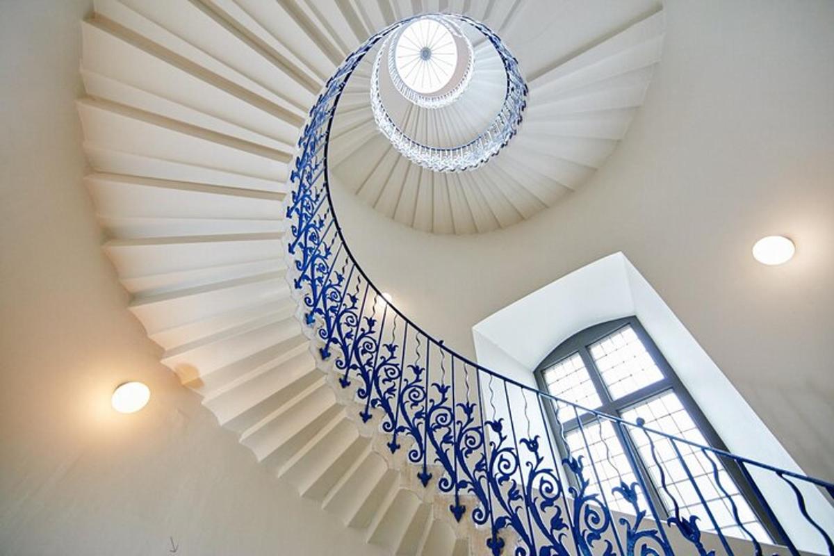 a spiral staircase with a blue and white stair case