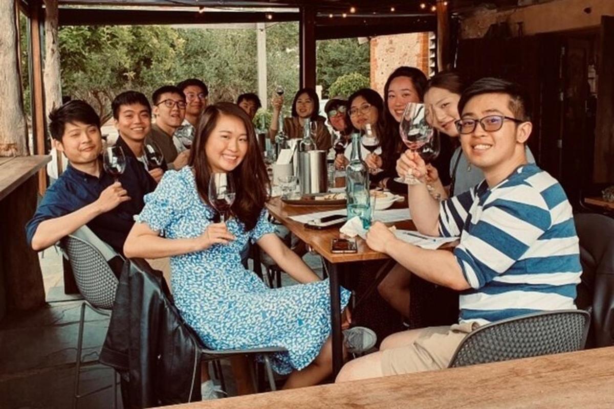 a group of people sitting at a table in a restaurant