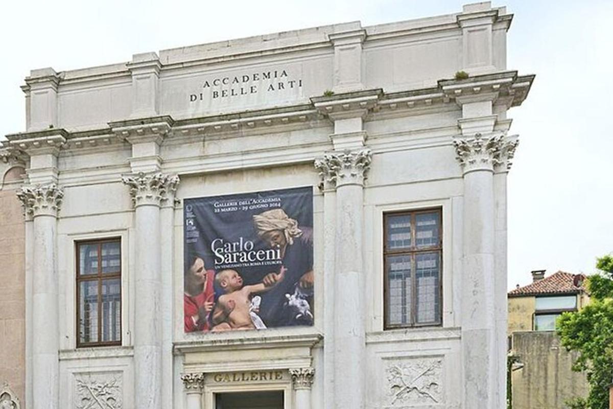 a white building with a poster on the side of it