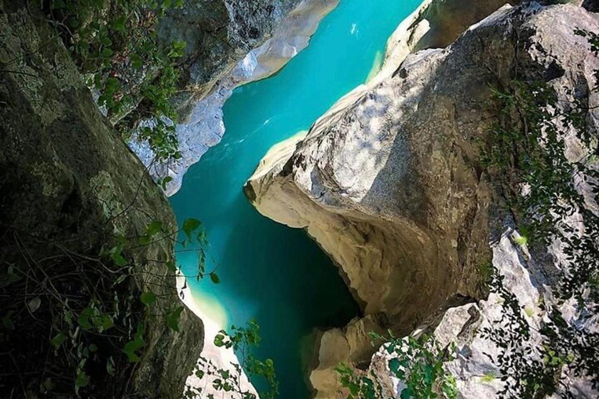an aerial view of a body of water between two rocks