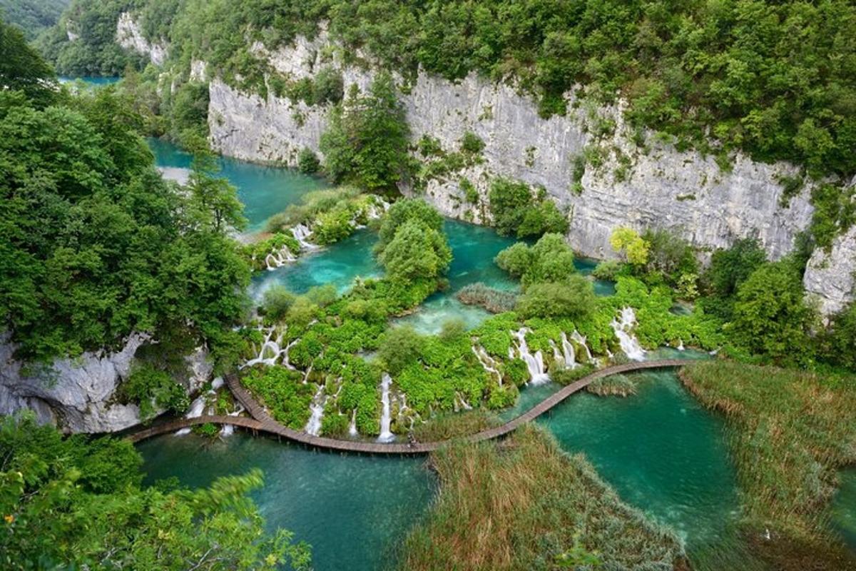 an aerial view of a river with blue water
