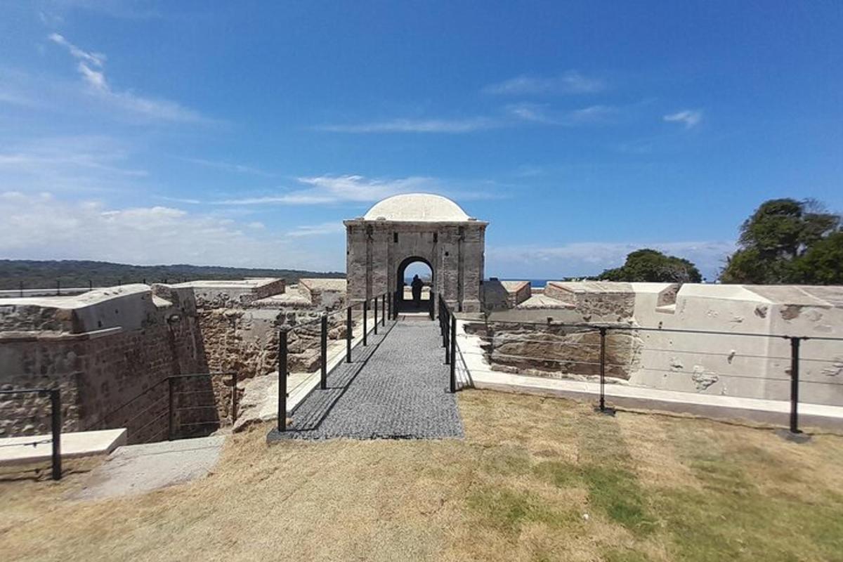 a gate to a building with an arch in it
