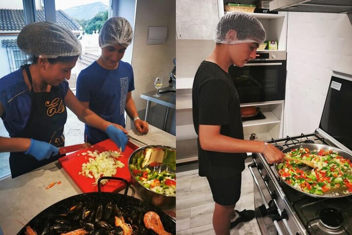 two people preparing food in a kitchen
