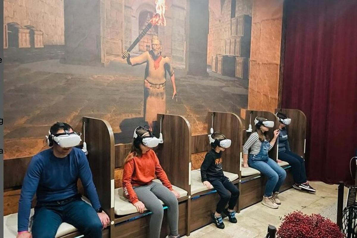 a group of people wearing virtual reality headsets in a theater