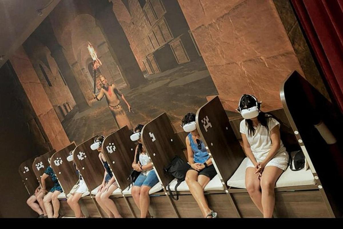 a group of people sitting in seats with masks on