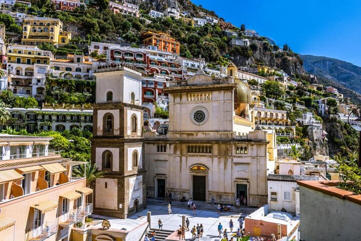 a building in front of a mountain with houses