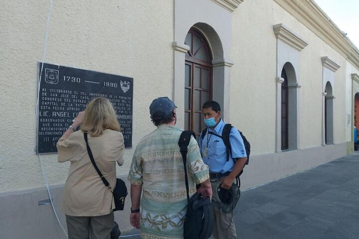 a group of people standing outside of a building