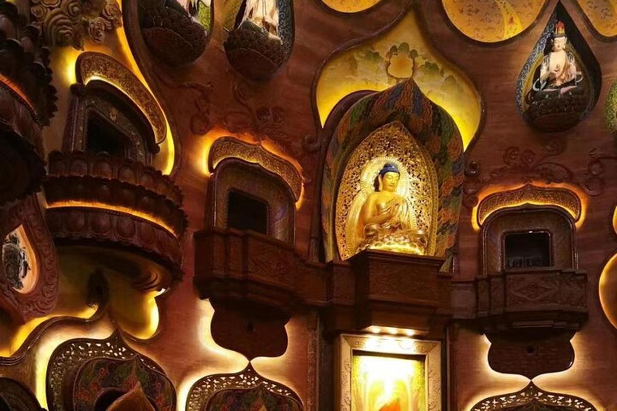 a wall with a shrine with a statue on it