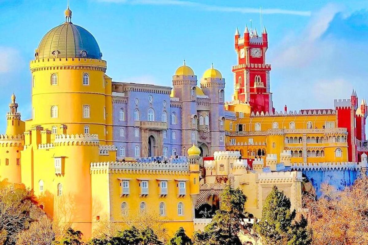 a large yellow building with a clock tower