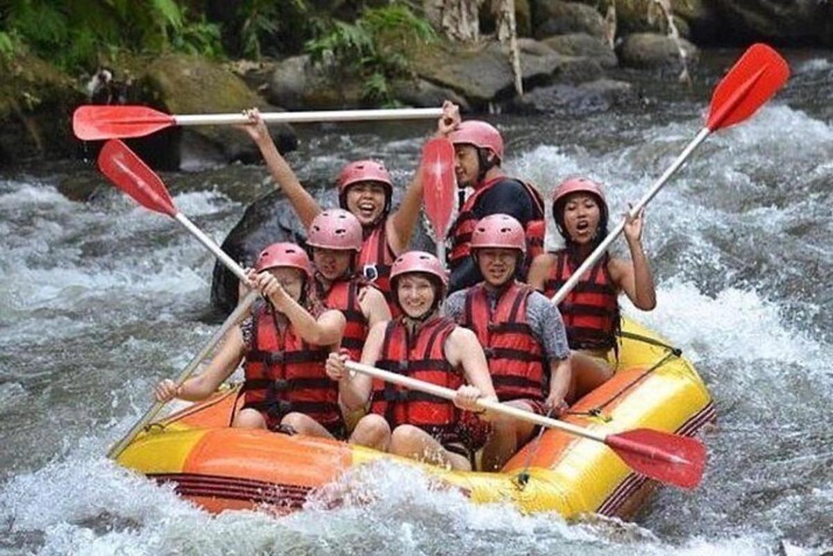 a group of people in a raft on a river