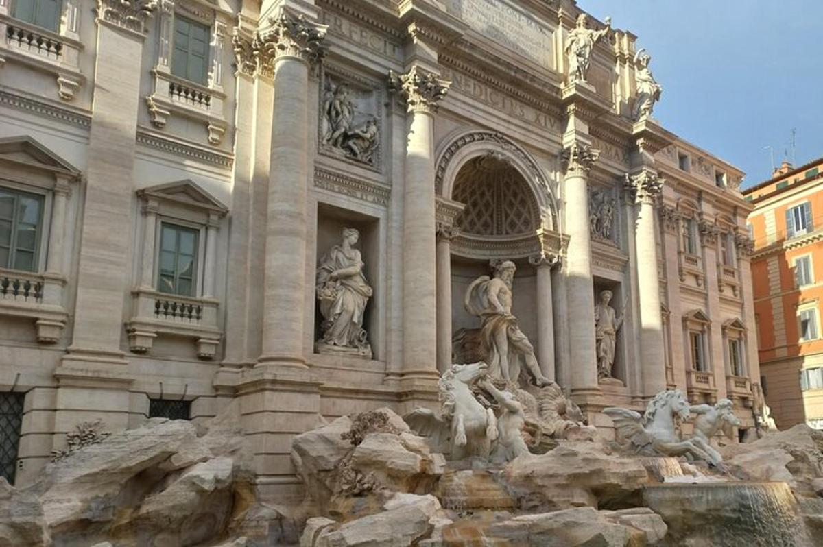 a building with a fountain in front of a building