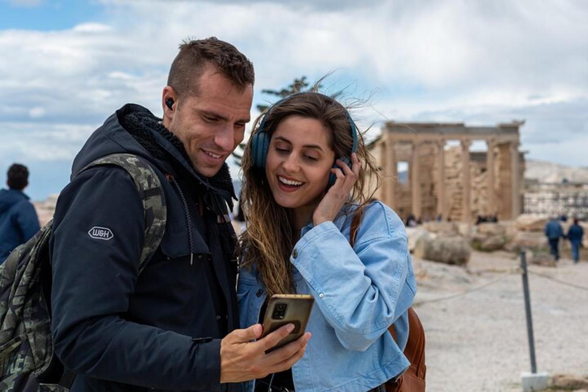 a man and a woman looking at a cell phone