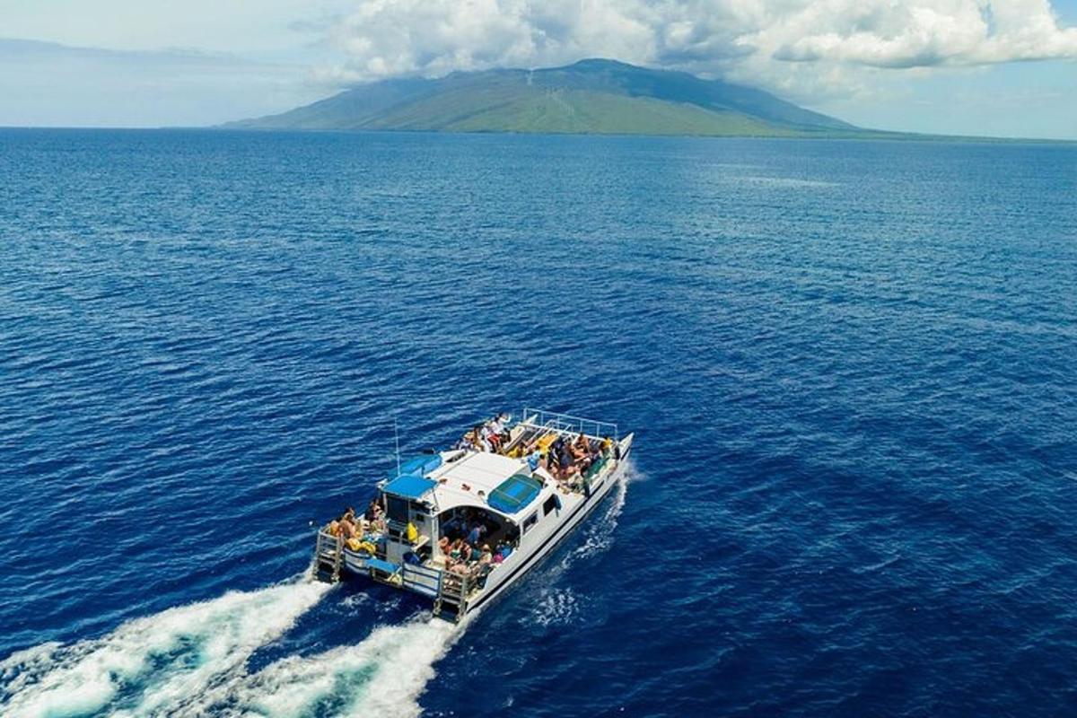 a group of people on a boat in the water