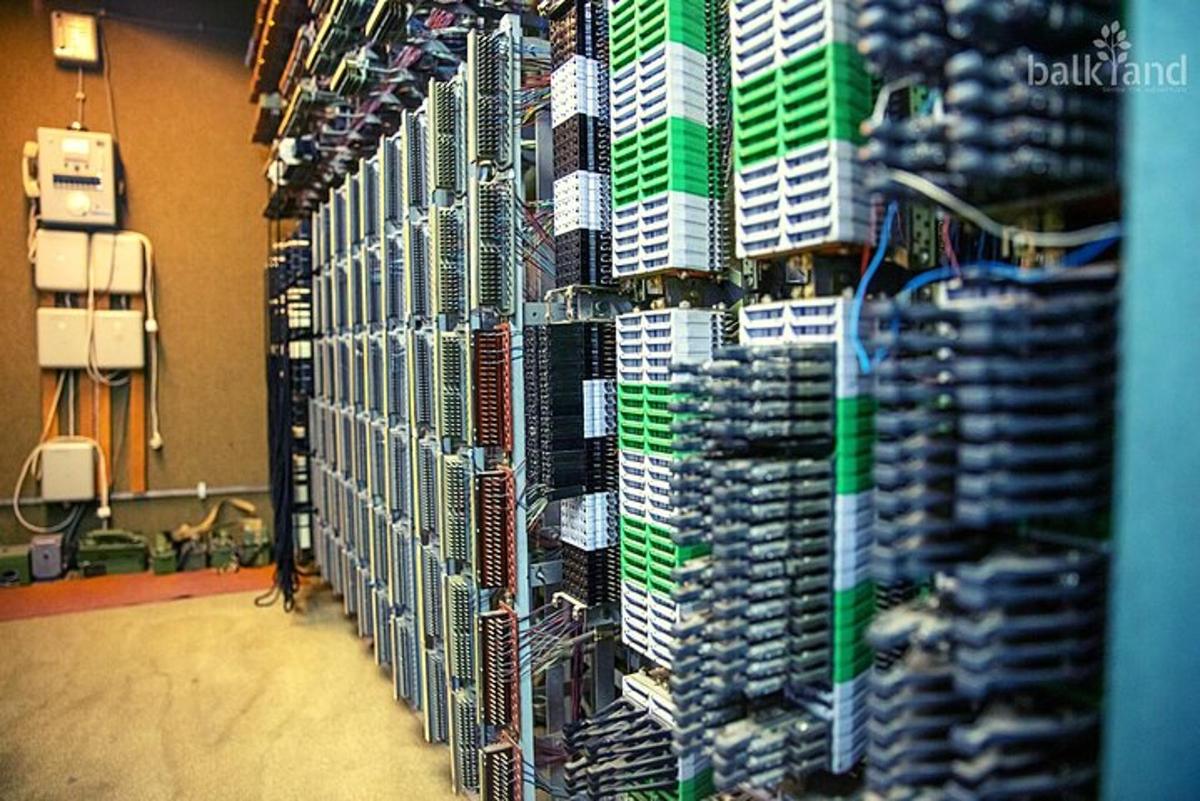 a room with a bunch of servers on a wall