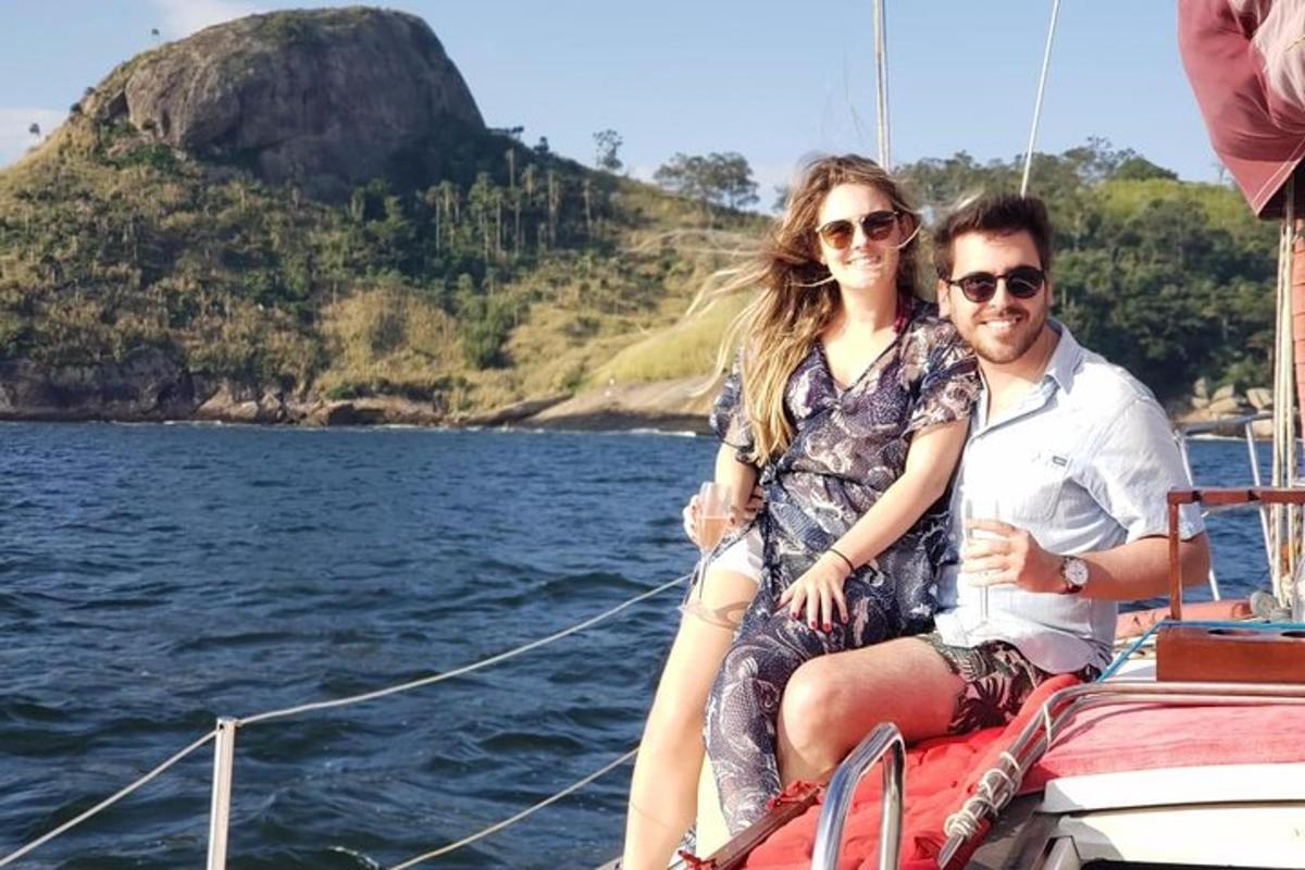 a man and a woman sitting on a boat