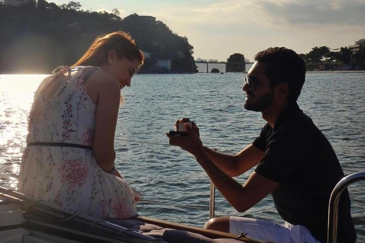 a man and woman on a boat in the water