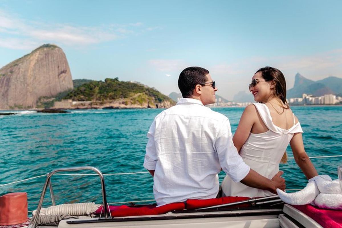 a man and a woman sitting on a boat