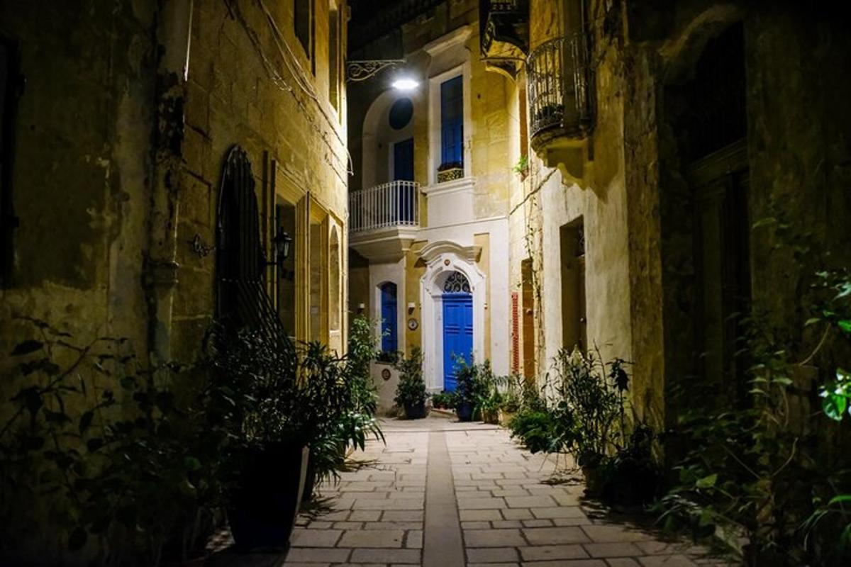 an alley with a blue door in a building