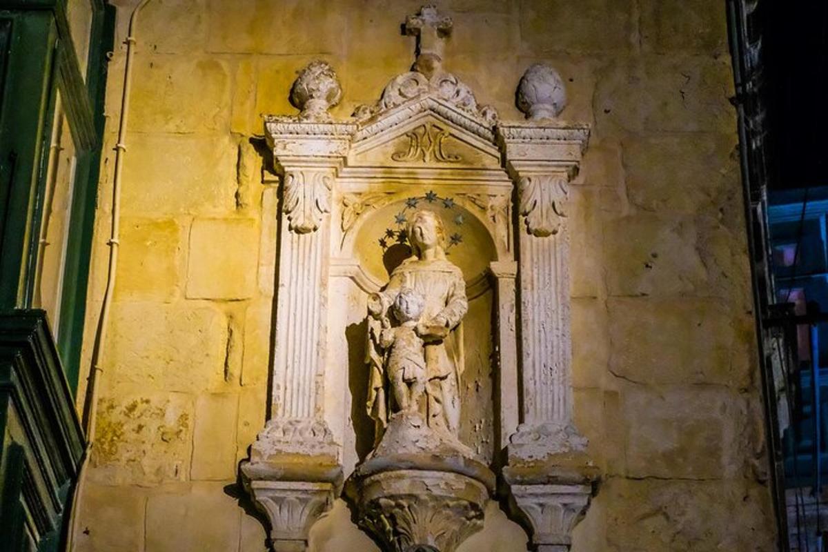 a statue on the side of a building