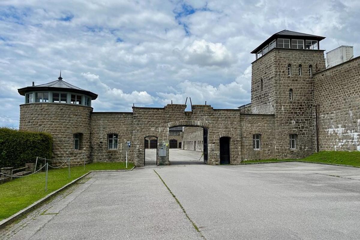 a large brick building with an archway on it