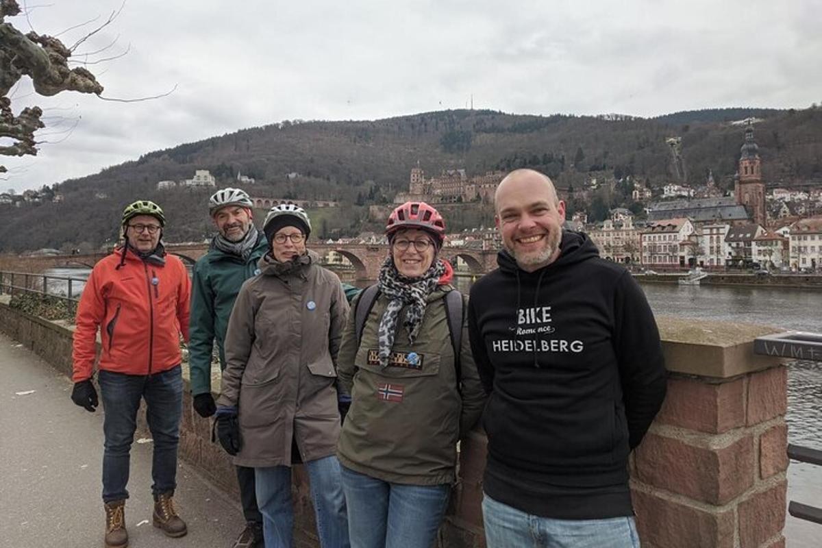 a group of people standing on a bridge