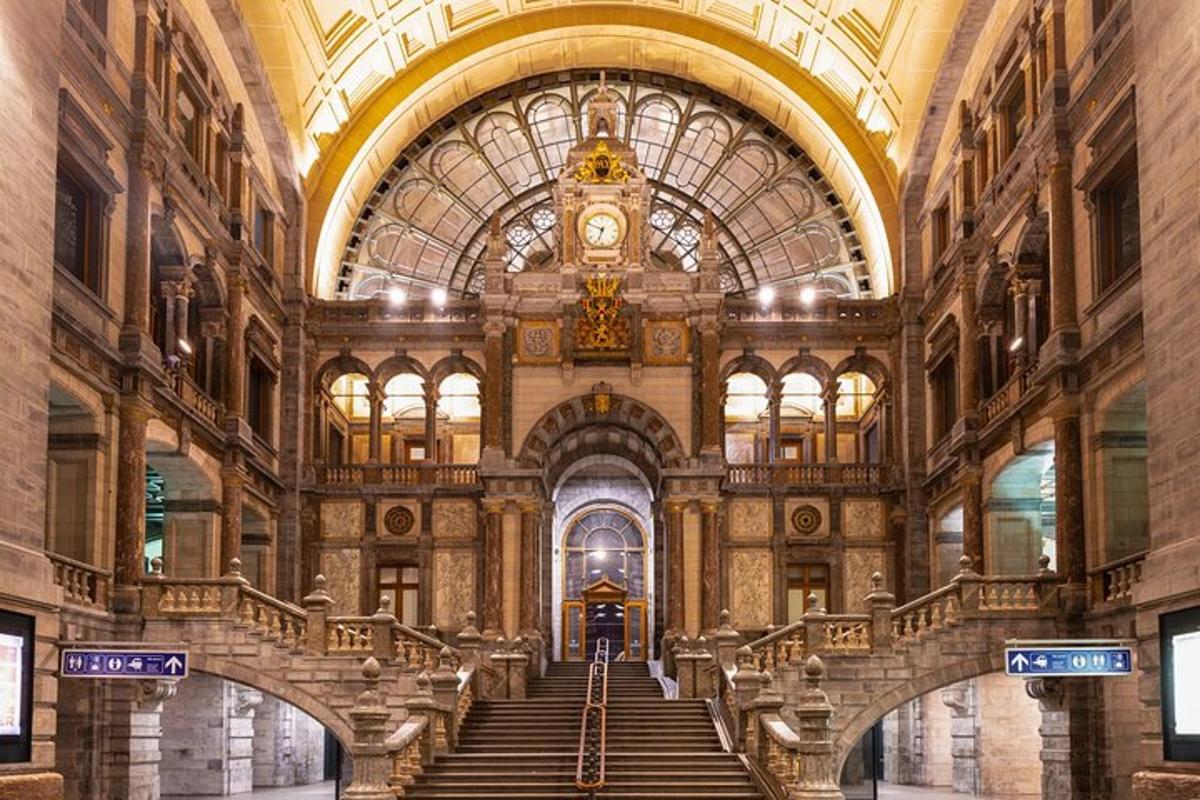 a large building with stairs and a clock on the ceiling