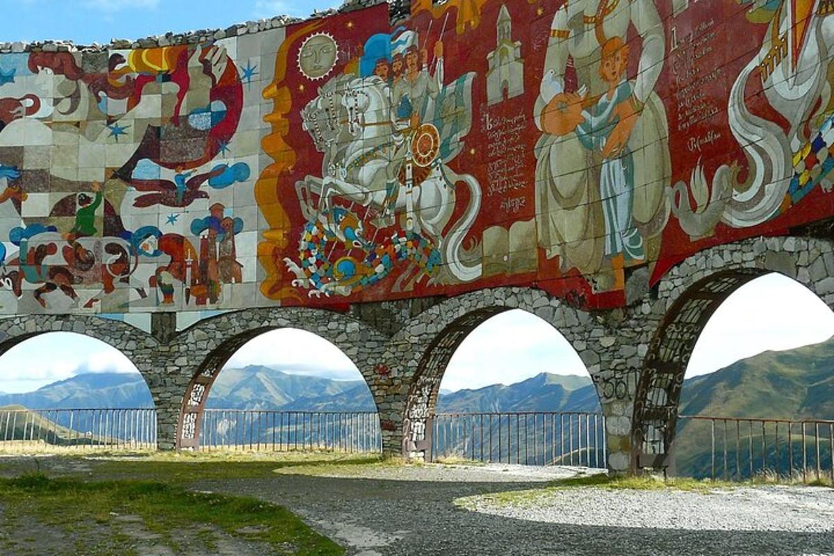 a mural on the side of a bridge