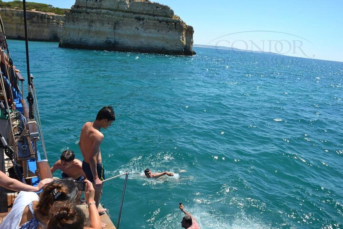 a group of people in the water on a boat